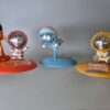 Flying Astronaut Mini Collectible on Blue Planet Base