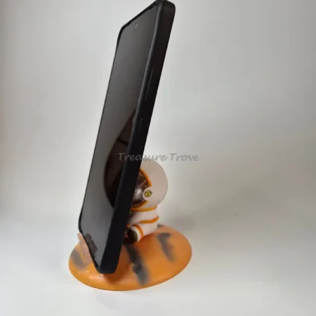 Sitting Astronaut Mini Showpiece on Orange Planet Phone
