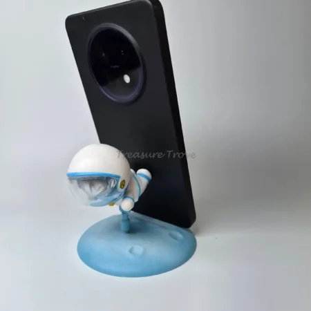 Flying Astronaut Mini Collectible on Blue Planet Base Phone